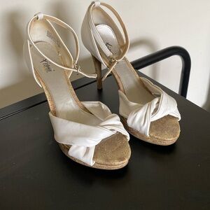 Cream color Fioni peep toe pumps with cork heel/platform. Size 8W.